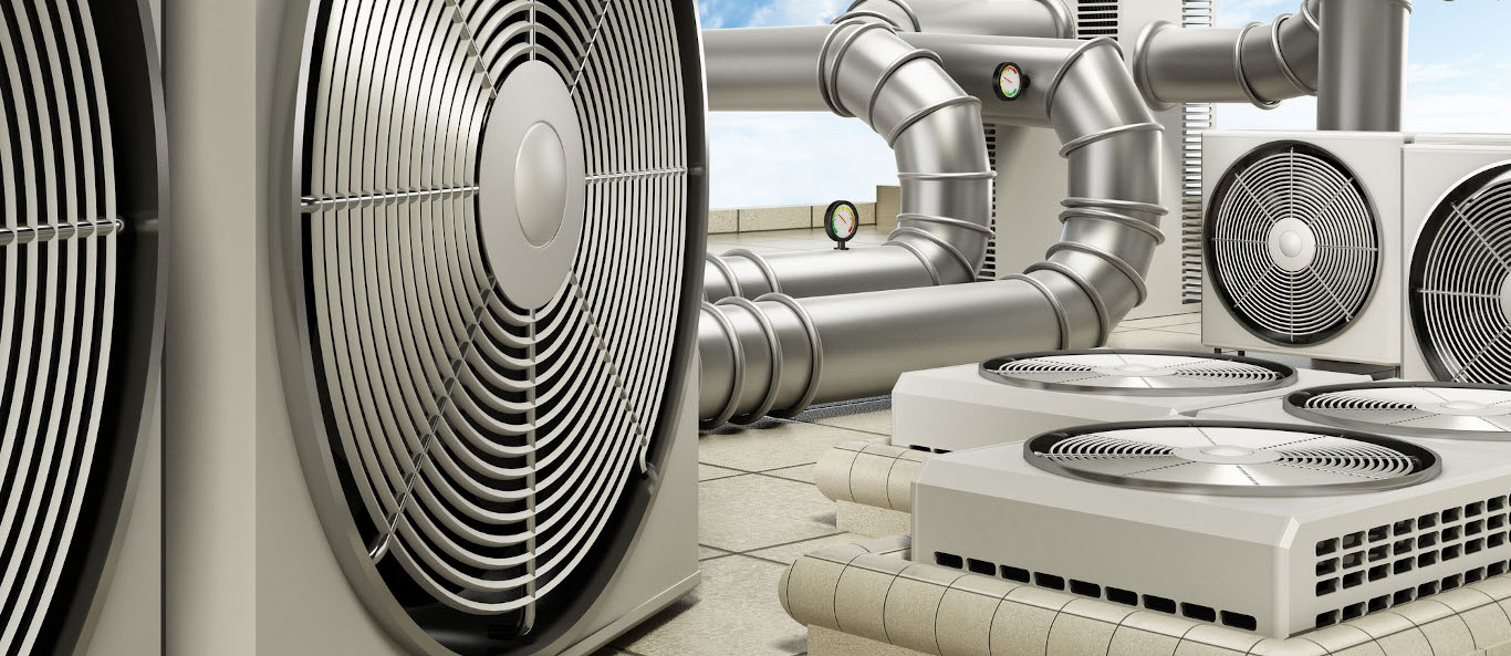 Air conditioning system with air conditioners, ventilators and pipes on top of a building.